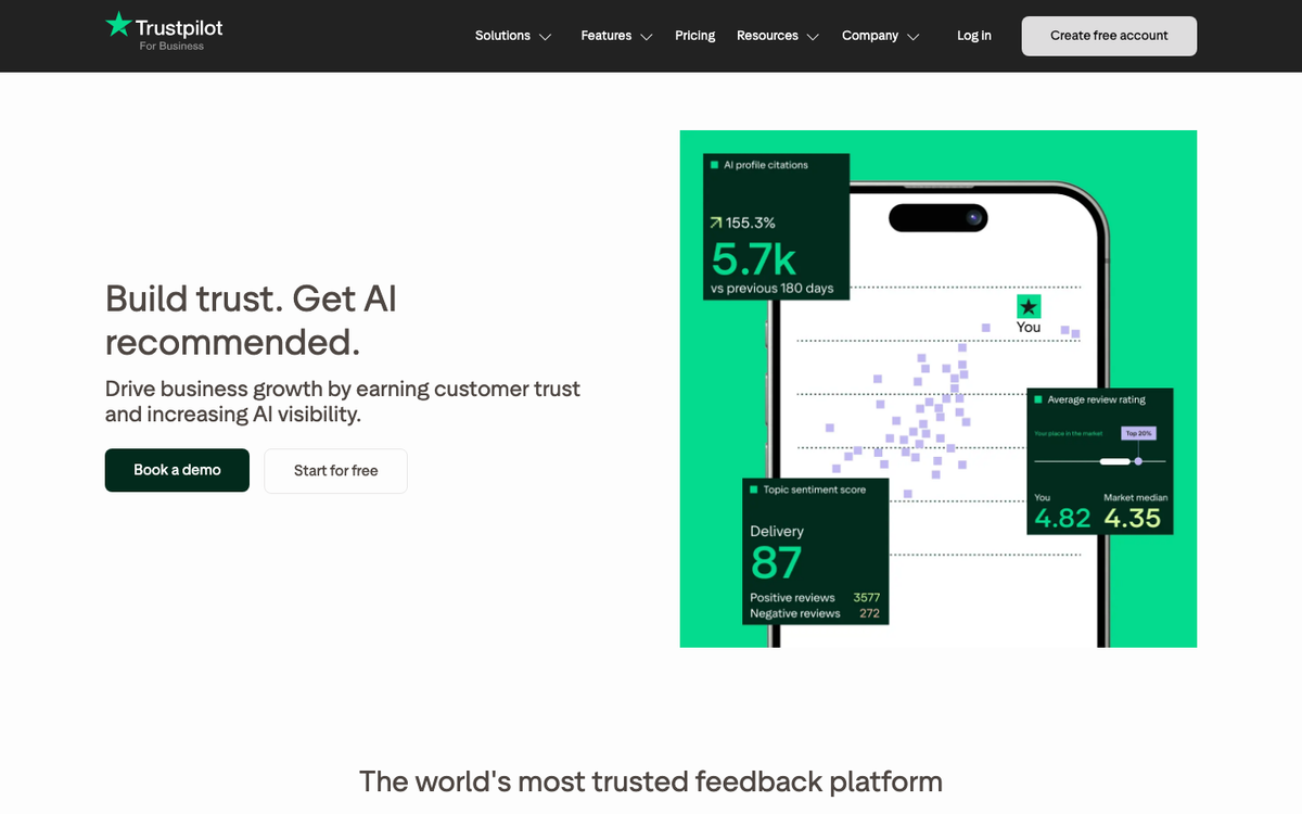 Trustpilot Business homepage hero in October 2026, headed 'Build trust. Get AI recommended.', with a phone showing a TrustScore