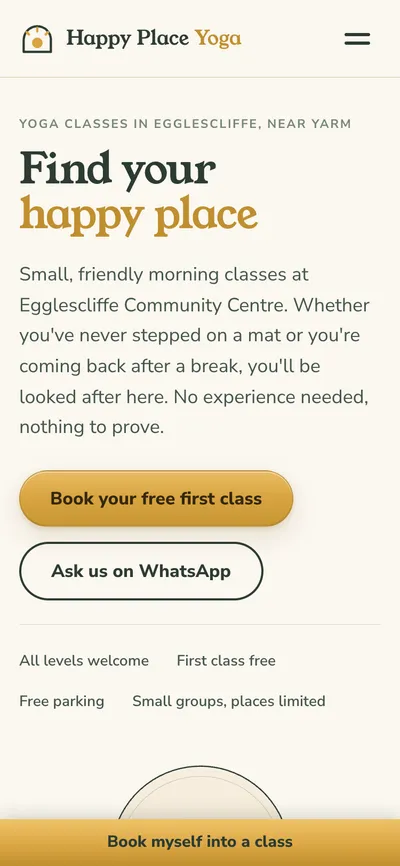 Happy Place Yoga's website on a phone